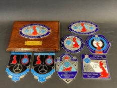 Eight assorted RAC International rally badges.