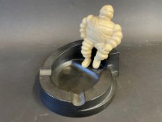 A Michelin bakelite ashtray surmounted by a seated Mr. Bibendum.