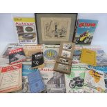 A box of assorted ephemera including motorcycle magazines, a framed and glazed study advertising