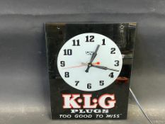 A K.L.G. Plugs Too Good To 'Miss' glass fronted Smiths Sectric advertising wall clock, 10 1/2 x