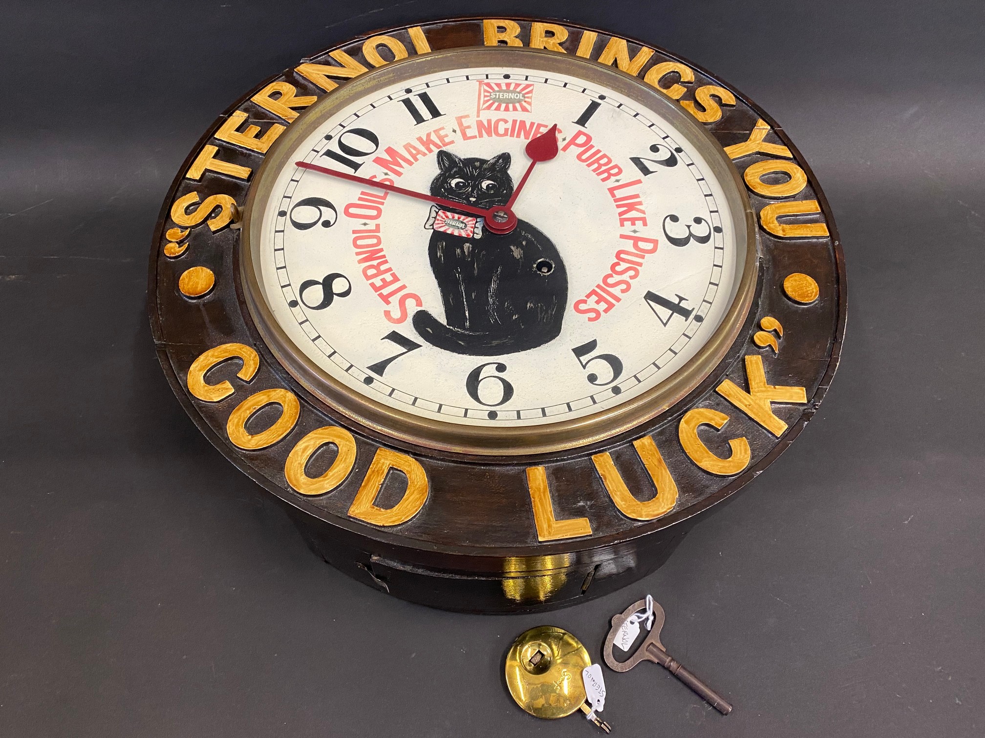 A rare Sternol wall clock bearing the words 'Sternol Brings You Good Luck', restored.