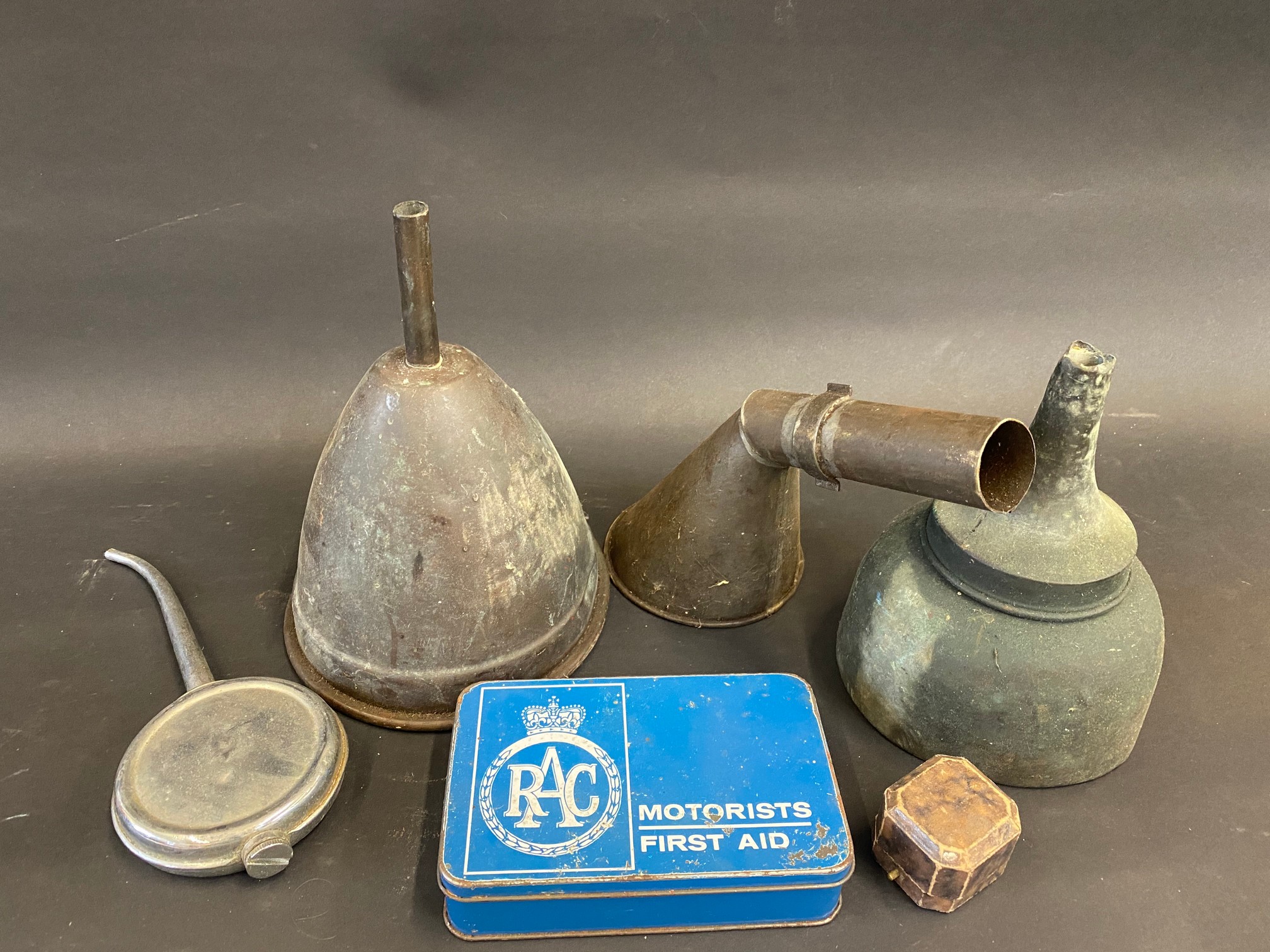 Two copper funnels, an RAC First Aid tin etc.