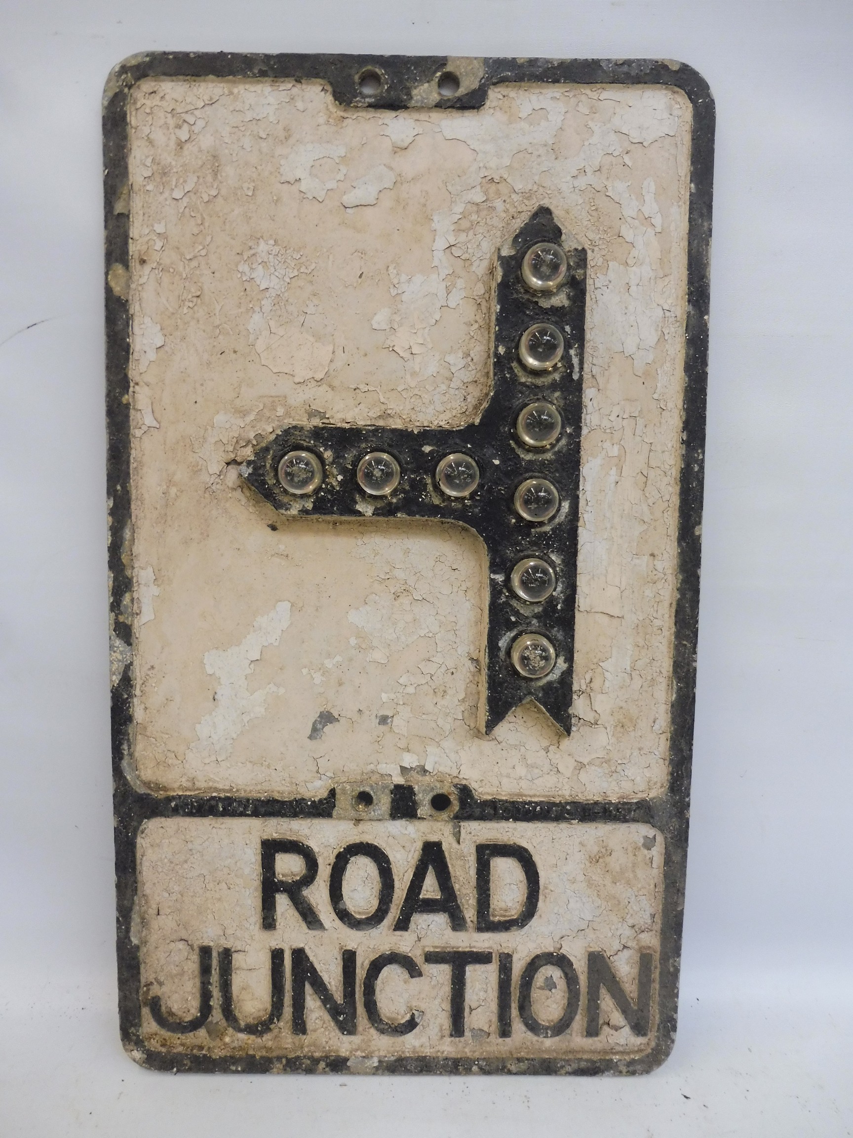 An aluminum road sign - Road Junction by Gowshall Limited with raised glass reflectors, 12 x 21".
