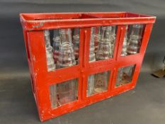 An Essolube 12-division crate containing a full set of correct glass pint oil bottles.