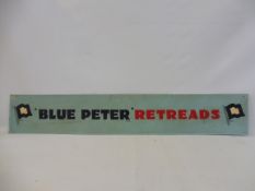A Blue Peter Retreads tin advertising sign, 48 x 8".