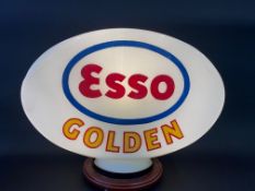 An Esso golden glass petrol pump globe, fully stamped underneath 'Property of Esso Petroleum Co.