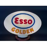 An Esso golden glass petrol pump globe, fully stamped underneath 'Property of Esso Petroleum Co.