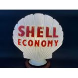 A Shell Economy glass petrol pump globe by Hailware, fully stamped underneath, one small chip to