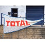 A large garage forecourt pennant flag advertising TOTAL by Piggotts 11' 11" x 68".