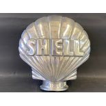 A contemporary polished aluminium clam Shell sign, 16 1/2 x 16 1/2.