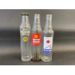 Three pint oil bottles including Havoline.