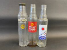 Three pint oil bottles including Havoline.