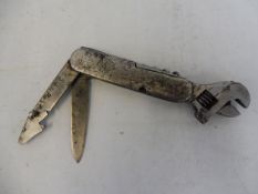 An unusual early Shell petrol motor oil company accessory multi tool which includes an adjustable