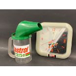 A Castrol one litre plastic measure and a Castrol TXT battery operated wall clock.