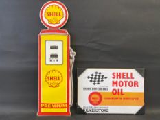 A contemporary tin Shell sign in the shape of a petrol pump, 10 x 32" plus a Shell Motor Oil branded