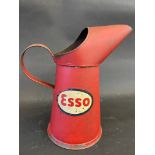 An Esso quart oil measure, in good condition.