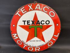 A Texaco Motor Oil circular enamel sign with some professional restoration, mounted on a board,