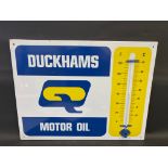 A Duckhams Motor Oil enamel thermometer by Burnham of London, in excellent condition, 26 1/2 x 20".