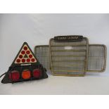 A Land Rover radiator grille plus a military issue trailer light cluster.