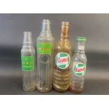 Four Castrol and BP glass oil bottles.