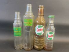 Four Castrol and BP glass oil bottles.