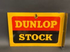 A Dunlop Stock double sided enamel sign with hanging flange, in excellent condition, 18 x 12".