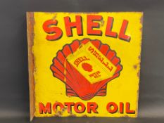 A rarely seen Shell Motor Oil double sided enamel sign with central image of a can pouring oil, re-