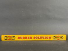 A Dunlop Rubber Solution shelf strip, in good condition.