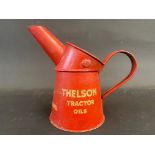 A Thelson Tractor Oils pint measure, in good condition.