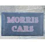 A Morris Cars rubber garage showroom mat.