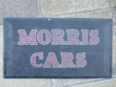 A Morris Cars rubber garage showroom mat.