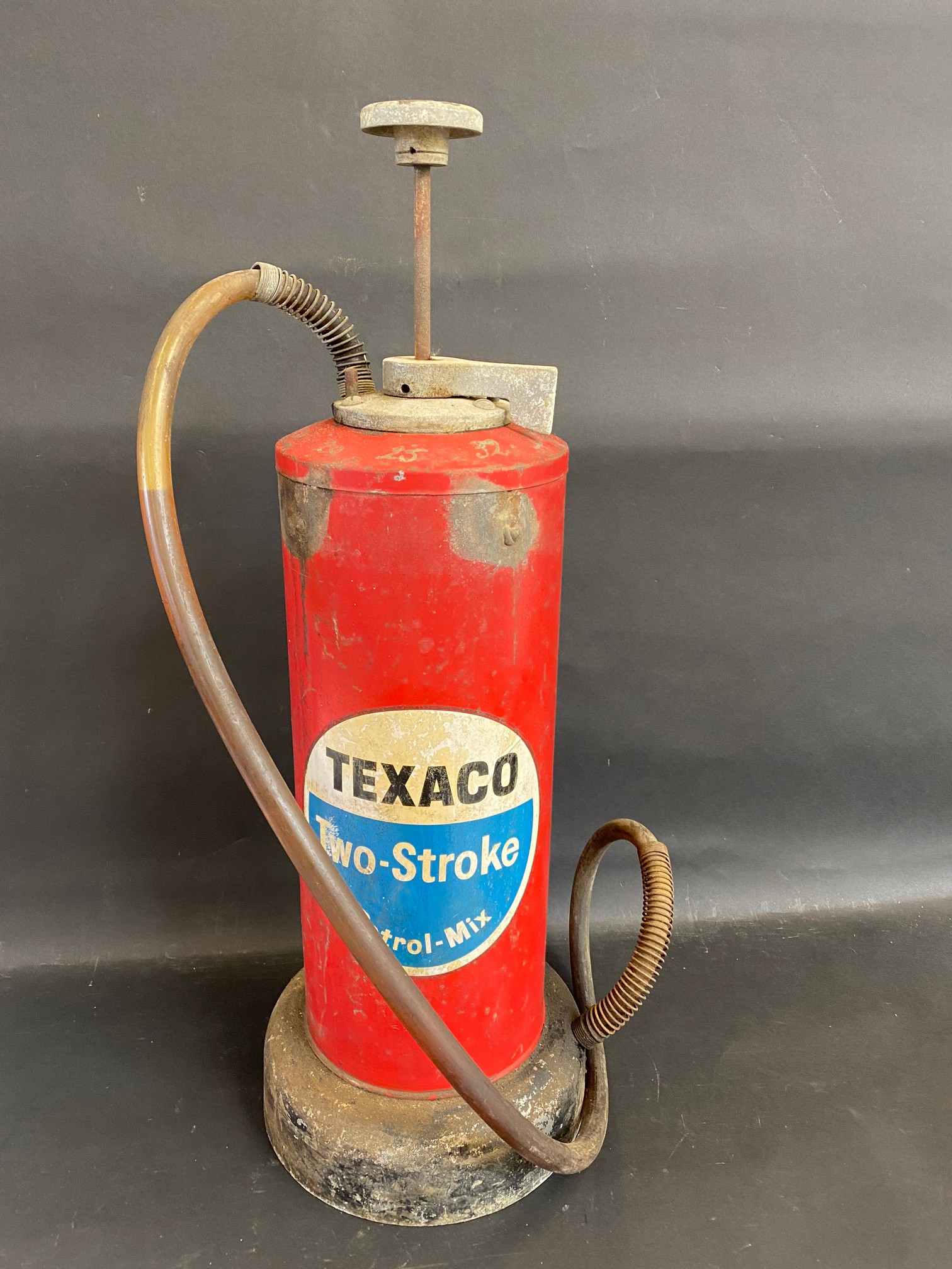 A Texaco two stroke garage forecourt dispenser.