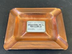 A copper ashtray with enamel insert advertising Worcestershire tyre co.