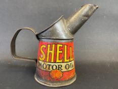 A Shell Motor Oil pint measure.