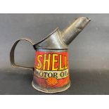 A Shell Motor Oil pint measure.