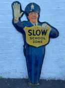 An unusual American tin advertising sign in the form of a standing policeman - Slow School Zone,