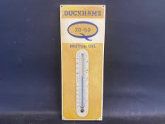 A small Duckham's 20-50 Motor Oil aluminium thermometer, 5 1/2 x 14".