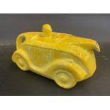 An Art Deco Sadler teapot in the form of a streamlined motor car, yellow version.