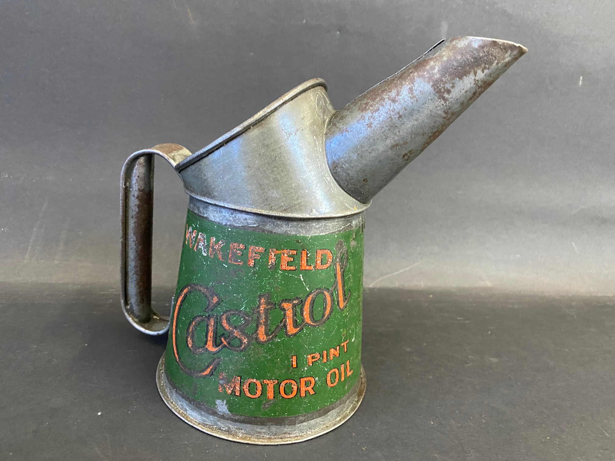 A Wakefield Castrol Motor Oil pint measure.