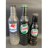 A Mobiloil quart oil bottle, a Castrol Motor Oil quart bottle and a pint Wakefield Castrol bottle.