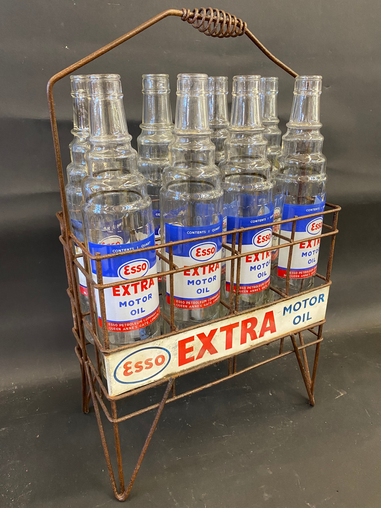 An Esso Extra Motor Oil eight division garage forecourt crate with eight correct glass bottles