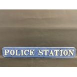A rare cast iron Police Station sign, marked Briggs Barrow, 48 x 7 1/2".