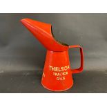 A Thelson Tractor Oils quart measure, in good condition.