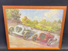 A framed and glazed jigsaw of two pre-war cars racing at Brooklands, one possibly the Napier