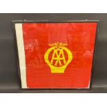 A framed and glazed red AA flag with yellow emblem to the centre, 27 1/2 x 26".