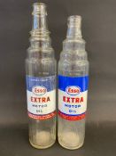 Two Esso Extra Motor Oil quart glass oil bottles.