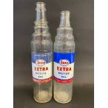 Two Esso Extra Motor Oil quart glass oil bottles.