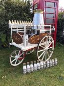 A Victorian dairy delivery pram in good condition, having been repainted 30 years ago.