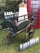 A Victorian dairy delivery pram in good condition having been repainted 15 years ago.