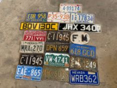 A collection of number plates, some early American.